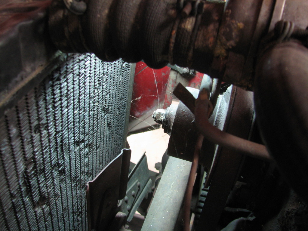 The radiator hose at the very top of this picture is returning to dust.  If you wiggle the hose, it rains particles into the air.