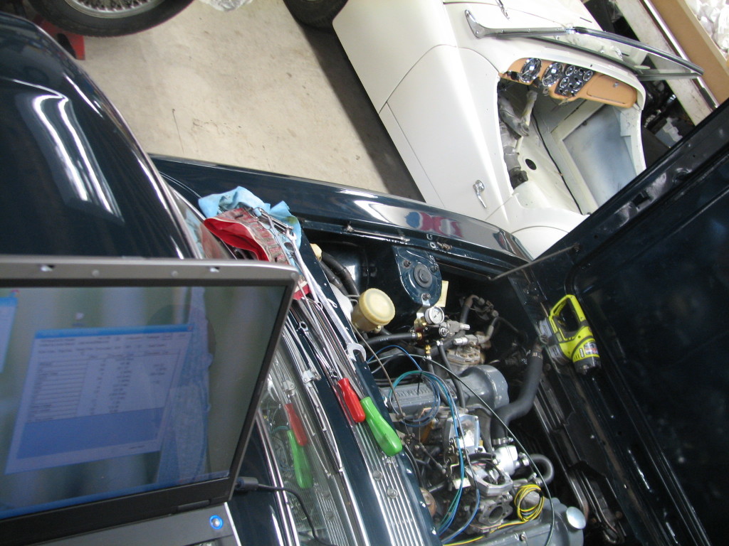 Here's the scene while we were trying to set the throttle position sensor.  Laptop on the roof, hood open.